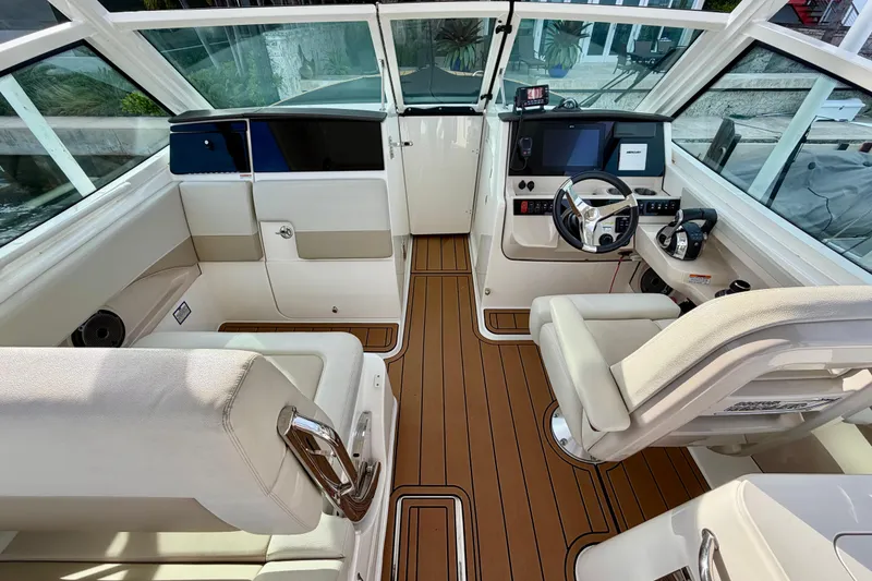 Slide: The Image of 2022 Boston Whaler 280 Vantage boat interior with modern helm and seating. - 13