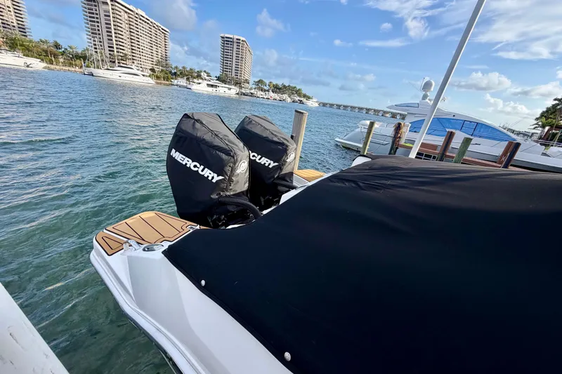 Slide: The Image of 2022 Boston Whaler 280 Vantage docked with Mercury engines, scenic waterfront view. - 18