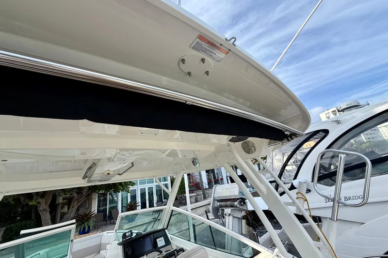 Slide: The Image of 2022 Boston Whaler 280 Vantage boat interior, showcasing helm and seating area. - 22