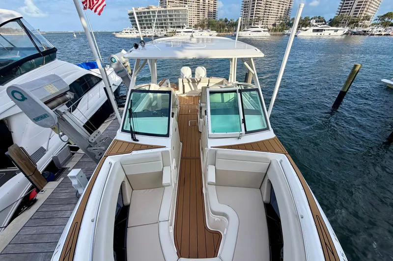 Slide: The Image of 2022 Boston Whaler 280 Vantage docked, showcasing spacious seating and sleek design. - 6
