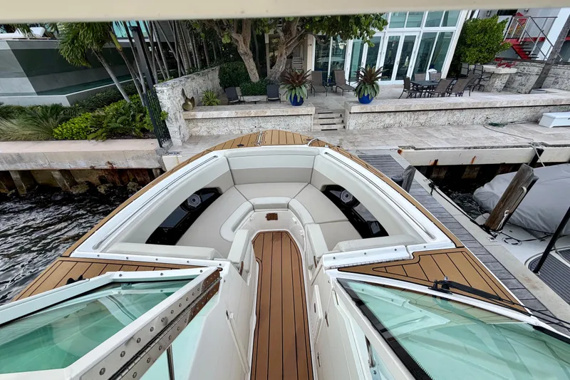 Slide: The Image of 2022 Boston Whaler 280 Vantage boat docked, featuring spacious seating and elegant design. - 8