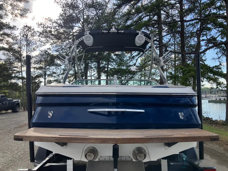 Slide: The Image of Rear view of a 2007 MasterCraft 200 Maristar VRS boat by the lake. - 6