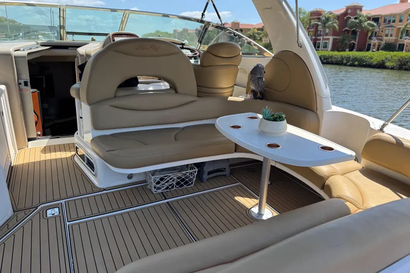 Slide: The Image of Luxurious 2002 Sea Ray 380 Sundancer yacht interior with plush seating and elegant table. - 12