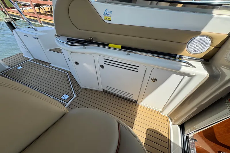 Slide: The Image of Interior view of 2002 Sea Ray 380 Sundancer boat with teak flooring and seating. - 16