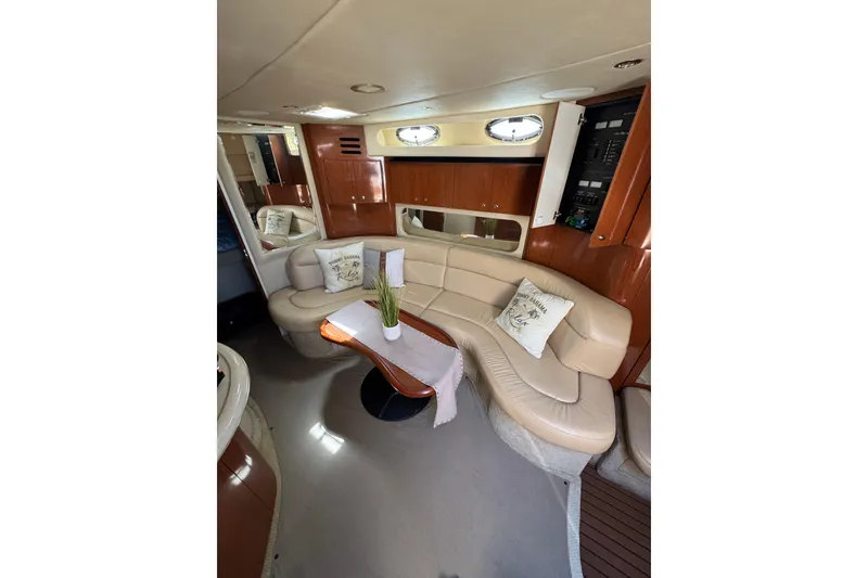 Slide: The Image of Luxurious interior of 2002 Sea Ray 380 Sundancer yacht with plush seating and elegant decor. - 24