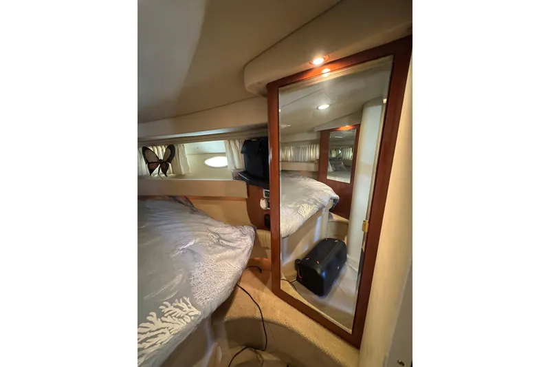 Slide: The Image of Cozy cabin interior of 2002 Sea Ray 380 Sundancer yacht with mirrored closet. - 27