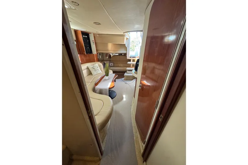 Slide: The Image of Interior of 2002 Sea Ray 380 Sundancer yacht with elegant seating and wooden finishes. - 29
