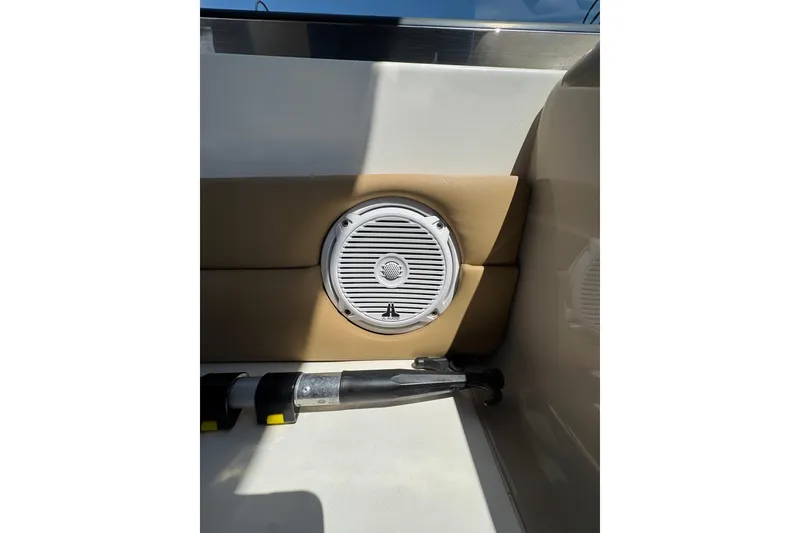 Slide: The Image of 2002 Sea Ray 380 Sundancer yacht with American flag on calm water. - 3