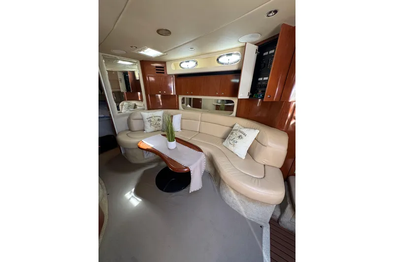 Slide: The Image of Luxurious interior of 2002 Sea Ray 380 Sundancer yacht with plush seating and elegant decor. - 34
