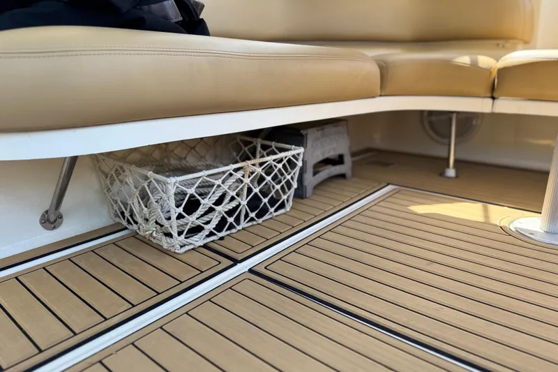 Slide: The Image of Interior of 2002 Sea Ray 380 Sundancer with beige seating and wooden flooring. - 41