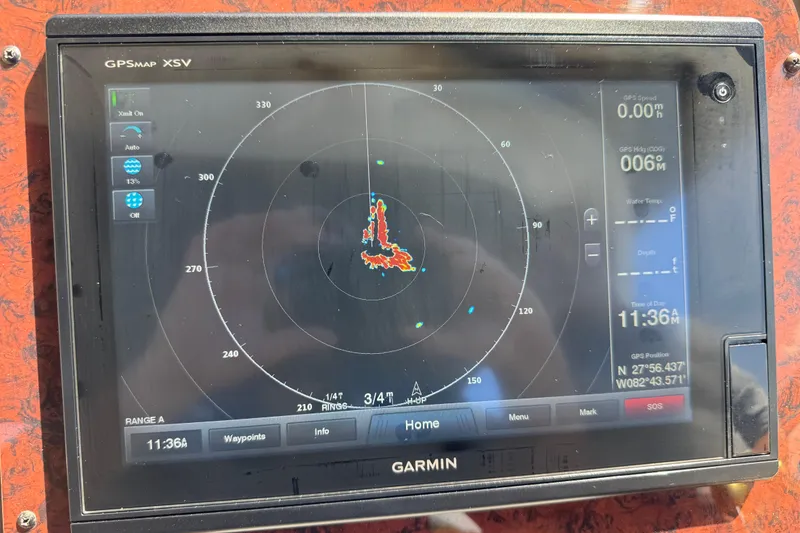 Slide: The Image of Garmin GPS display on 2002 Sea Ray 380 Sundancer, showing navigation and radar data. - 46