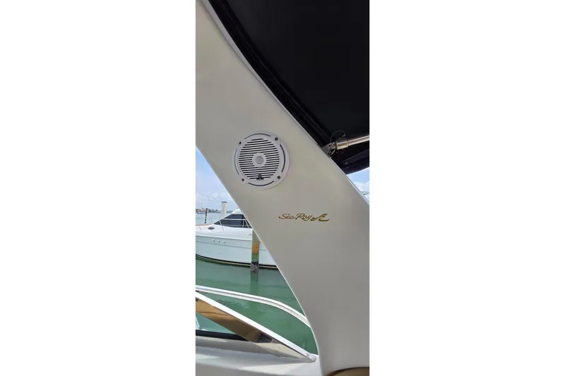 Slide: The Image of 2002 Sea Ray 380 Sundancer boat interior with speaker and logo detail. - 58