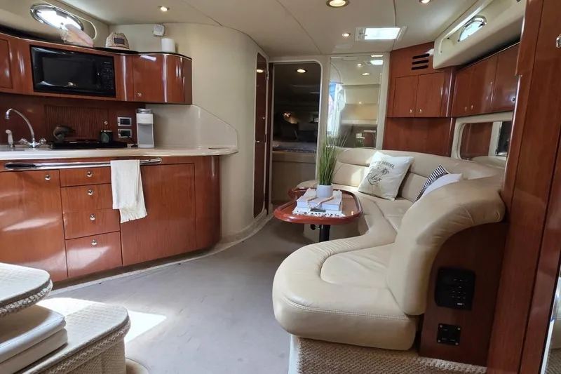 Slide: The Image of Luxurious interior of a 2002 Sea Ray 380 Sundancer yacht with elegant wood cabinetry. - 66