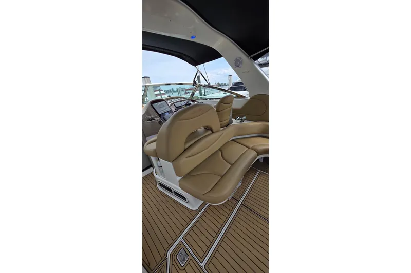 Slide: The Image of Interior view of 2002 Sea Ray 380 Sundancer yacht with tan leather seating. - 69