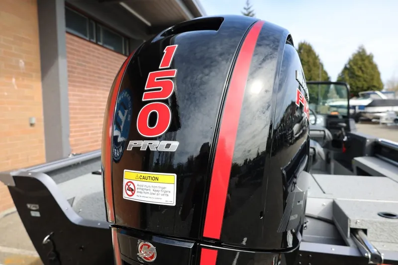 Slide: The Image of 2026 Lund 1875 Impact XS Sport boat with 150 Pro outboard motor. - 16