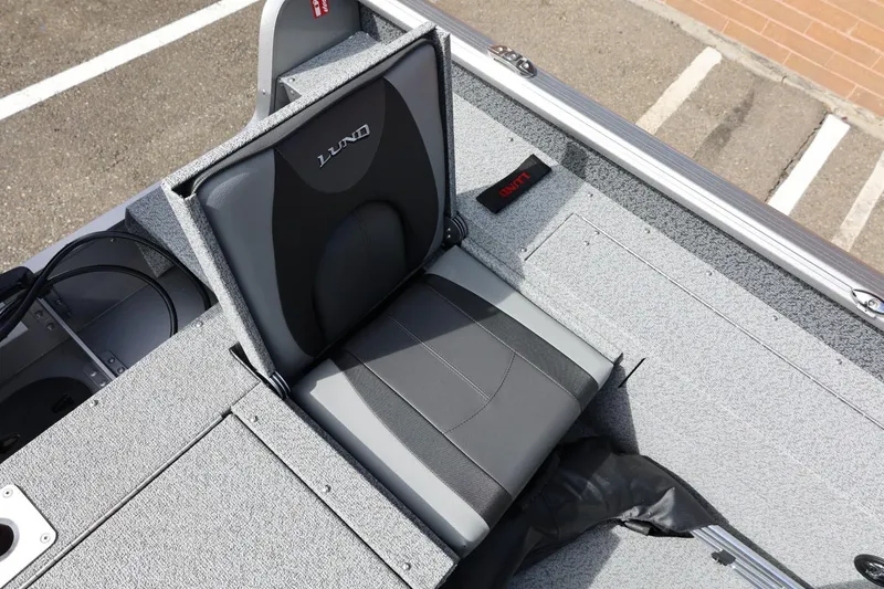 Slide: The Image of 2026 Lund 1875 Impact XS Sport boat seat, gray and black upholstery, top view. - 25