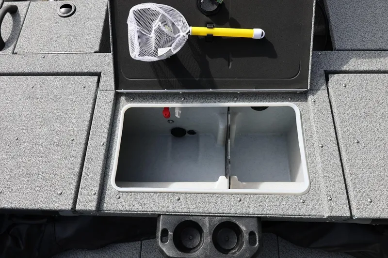 Slide: The Image of 2026 Lund 1875 Impact XS Sport boat interior with storage compartment and fishing net. - 27