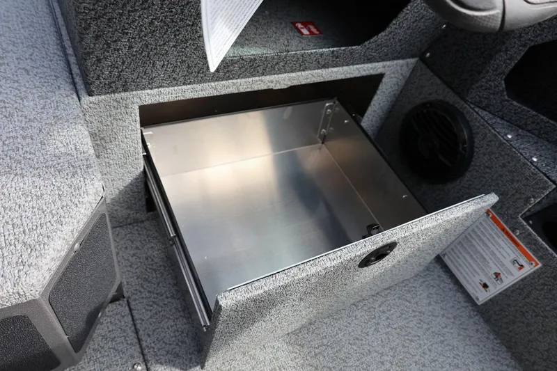 Slide: The Image of Open storage compartment in 2026 Lund 1875 Impact XS Sport boat interior. - 39
