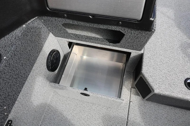 Slide: The Image of 2026 Lund 1875 Impact XS Sport boat interior storage compartment open. - 43