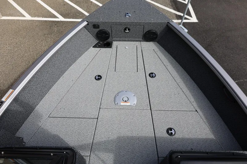 Slide: The Image of 2026 Lund 1875 Impact XS Sport boat deck with storage compartments and speakers. - 45