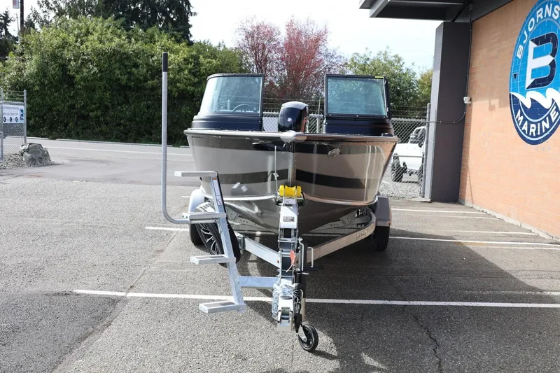 Slide: The Image of 2026 Lund 1875 Impact XS Sport boat on trailer at Bjornson Marine. - 5