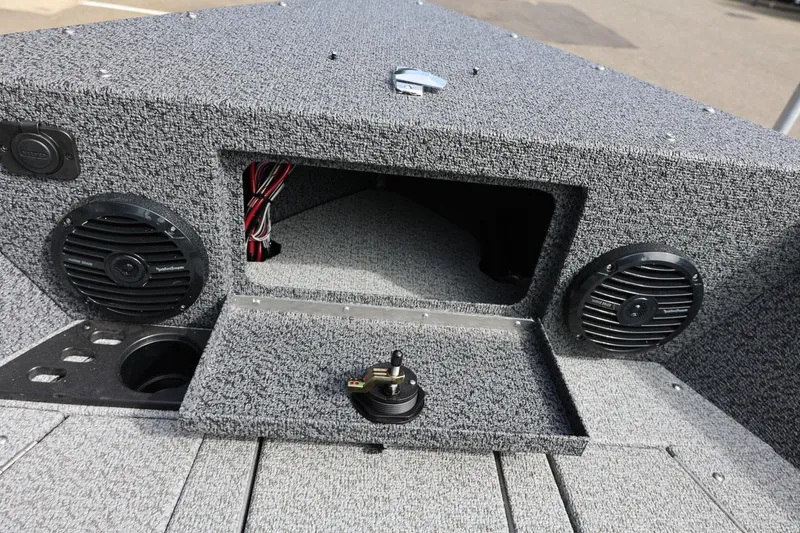 Slide: The Image of Interior of 2026 Lund 1875 Impact XS Sport boat with speakers and storage compartment. - 50