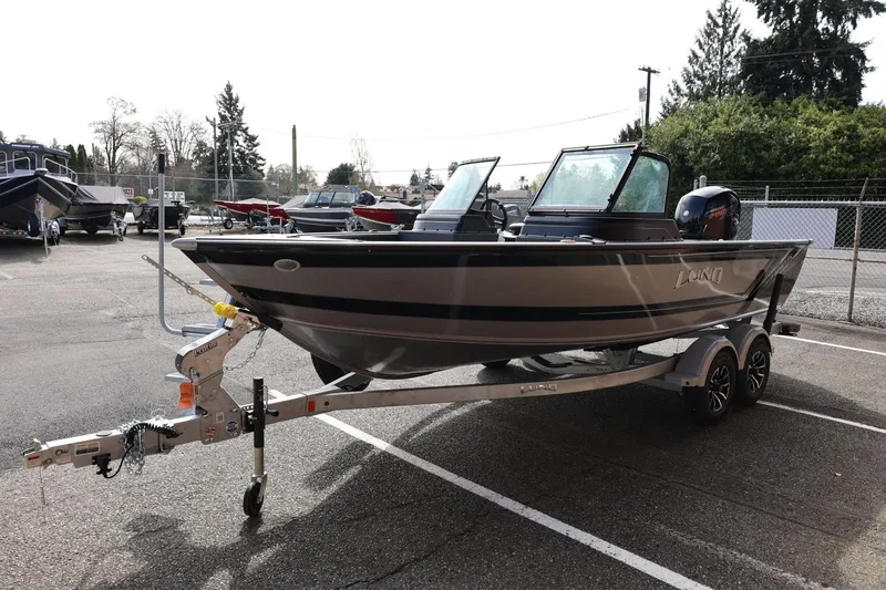 Slide: The Image of 2026 Lund 1875 Impact XS Sport boat on trailer in parking lot. - 7