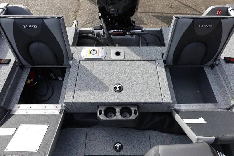 Slide: The Image of 2026 Lund 1875 Impact XS Sport boat interior with seating and storage compartments. - 23