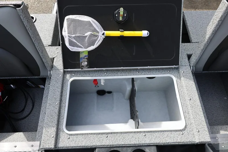 Slide: The Image of 2026 Lund 1875 Impact XS Sport boat livewell with fishing net and storage compartment. - 24
