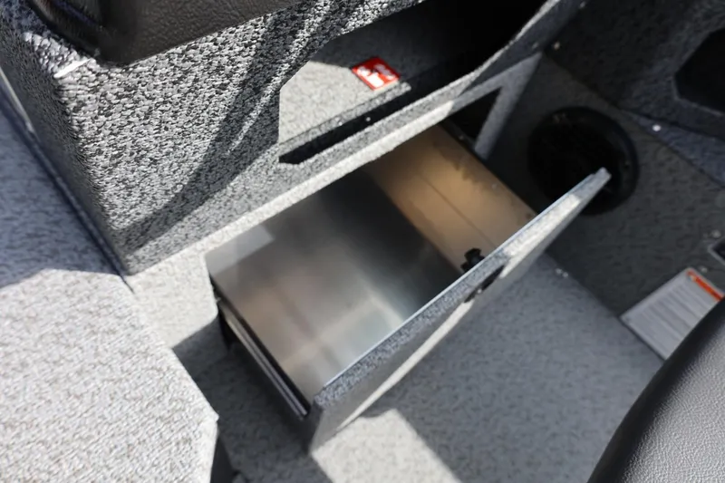 Slide: The Image of Open storage compartment in 2026 Lund 1875 Impact XS Sport boat interior. - 35