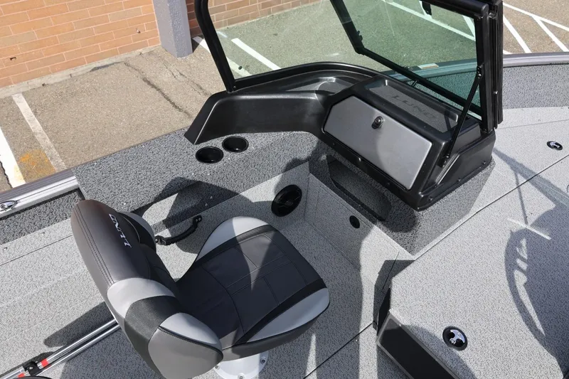 Slide: The Image of 2026 Lund 1875 Impact XS Sport boat interior with seating and console. - 36