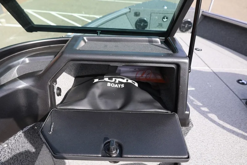 Slide: The Image of Open storage compartment in 2026 Lund 1875 Impact XS Sport boat. - 39