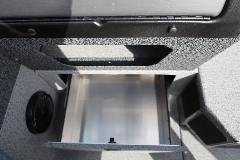 Slide: The Image of Interior storage compartment of 2026 Lund 1875 Impact XS Sport boat. - 40