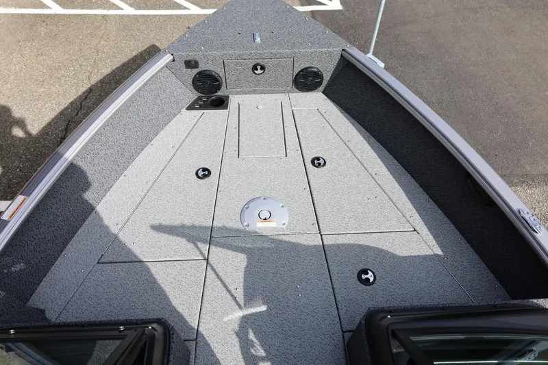 Slide: The Image of 2026 Lund 1875 Impact XS Sport boat deck with storage compartments and speakers. - 42