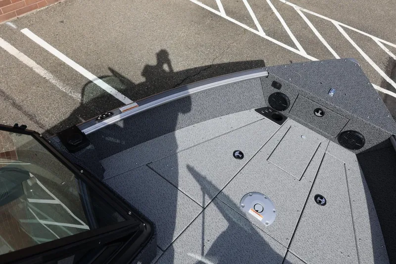 Slide: The Image of 2026 Lund 1875 Impact XS Sport boat deck with storage compartments and speakers. - 43