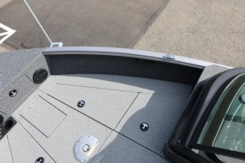 Slide: The Image of 2026 Lund 1875 Impact XS Sport boat deck with storage compartments and speaker. - 44