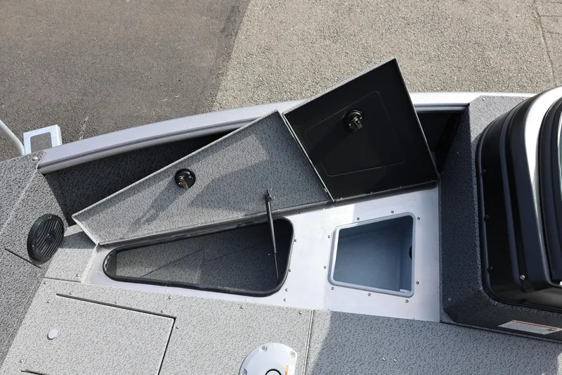 Slide: The Image of 2026 Lund 1875 Impact XS Sport boat interior with open storage compartments. - 45