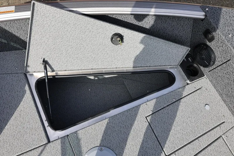 Slide: The Image of 2026 Lund 1875 Impact XS Sport boat storage compartment with open hatch, showcasing interior space. - 47