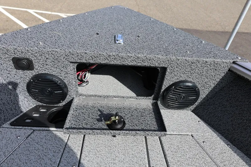 Slide: The Image of 2026 Lund 1875 Impact XS Sport boat interior with speakers and storage compartment. - 49