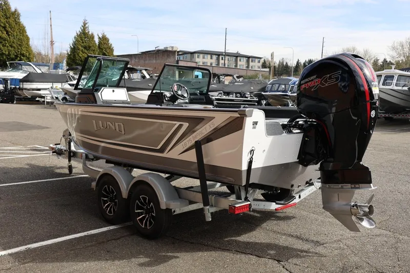 Slide: The Image of 2026 Lund 1875 Impact XS Sport boat with Mercury Pro XS engine on trailer. - 9