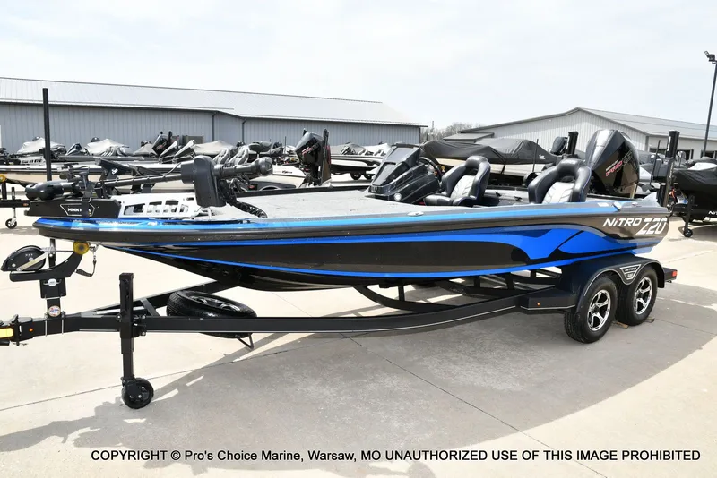 Slide: The Image of 2023 Nitro Z20 Pro boat on trailer outdoors. - 31