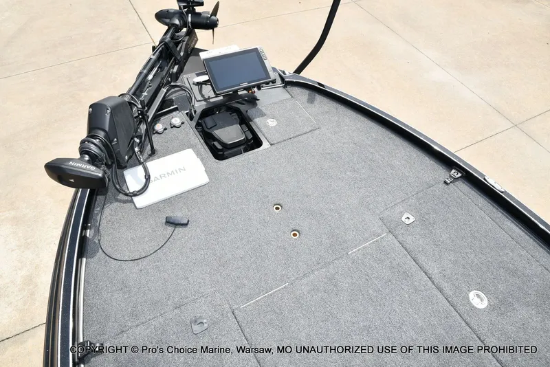 Slide: The Image of Triton 21XP 2025 boat with Garmin equipment on gray deck. - 12