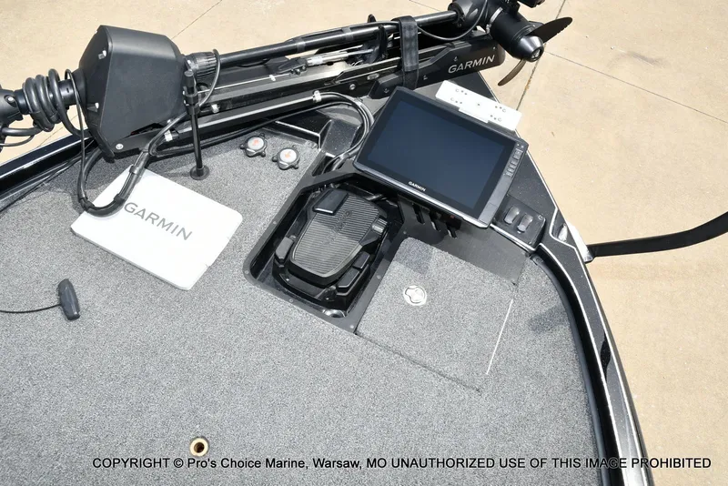 Slide: The Image of Triton 21XP 2025 boat featuring Garmin technology and controls. - 13