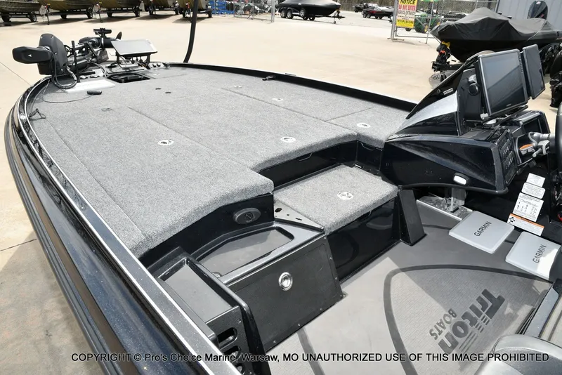 Slide: The Image of Interior view of 2025 Triton 21XP boat with modern features. - 16