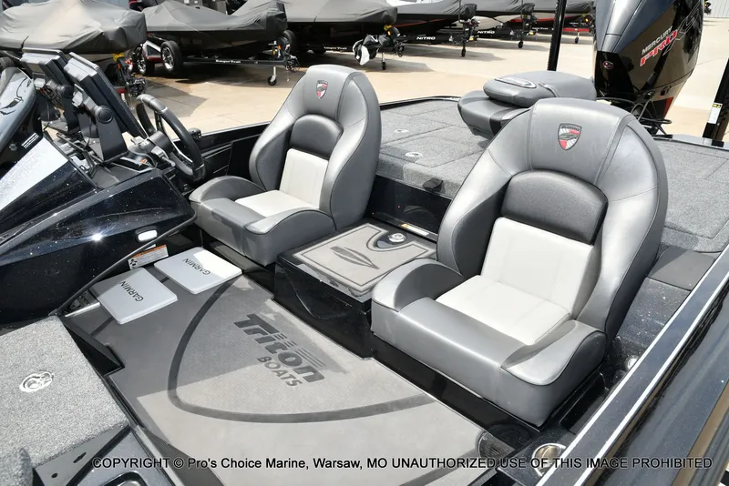 Slide: The Image of Interior of 2025 Triton 21XP with gray leather seats. - 18