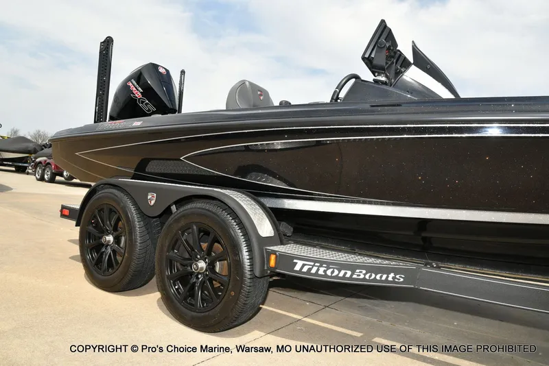 Slide: The Image of 2025 Triton 21XP boat on trailer, side view. - 19