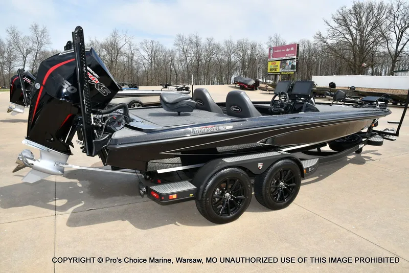 Slide: The Image of 2025 Triton 21XP boat on trailer, side view. - 21