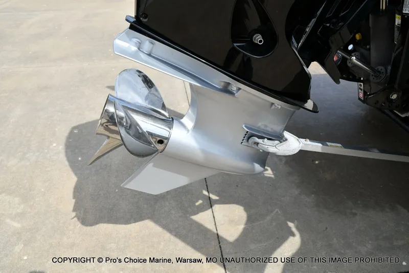 Slide: The Image of Triton 21XP 2025 boat motor with shiny propeller. - 24