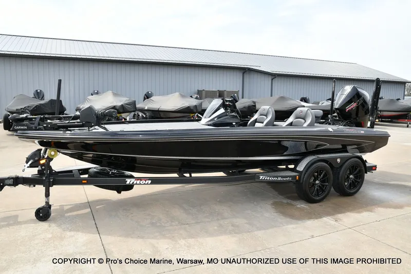 Slide: The Image of 2025 Triton 21XP boat on trailer, black color, exterior view. - 27