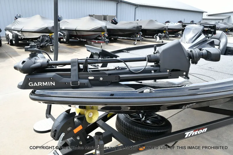 Slide: The Image of 2025 Triton 21XP boat with Garmin equipment on trailer. - 28